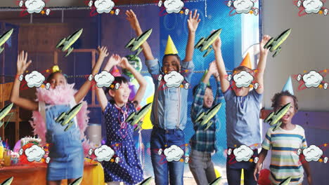 rocket and cloud icon moving against kids wearing party hats dancing