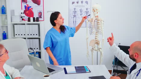 nurse giving presentation using skeleton model