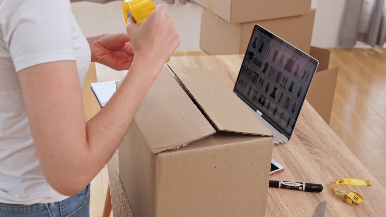 Woman Packing and Preparing an Online Order