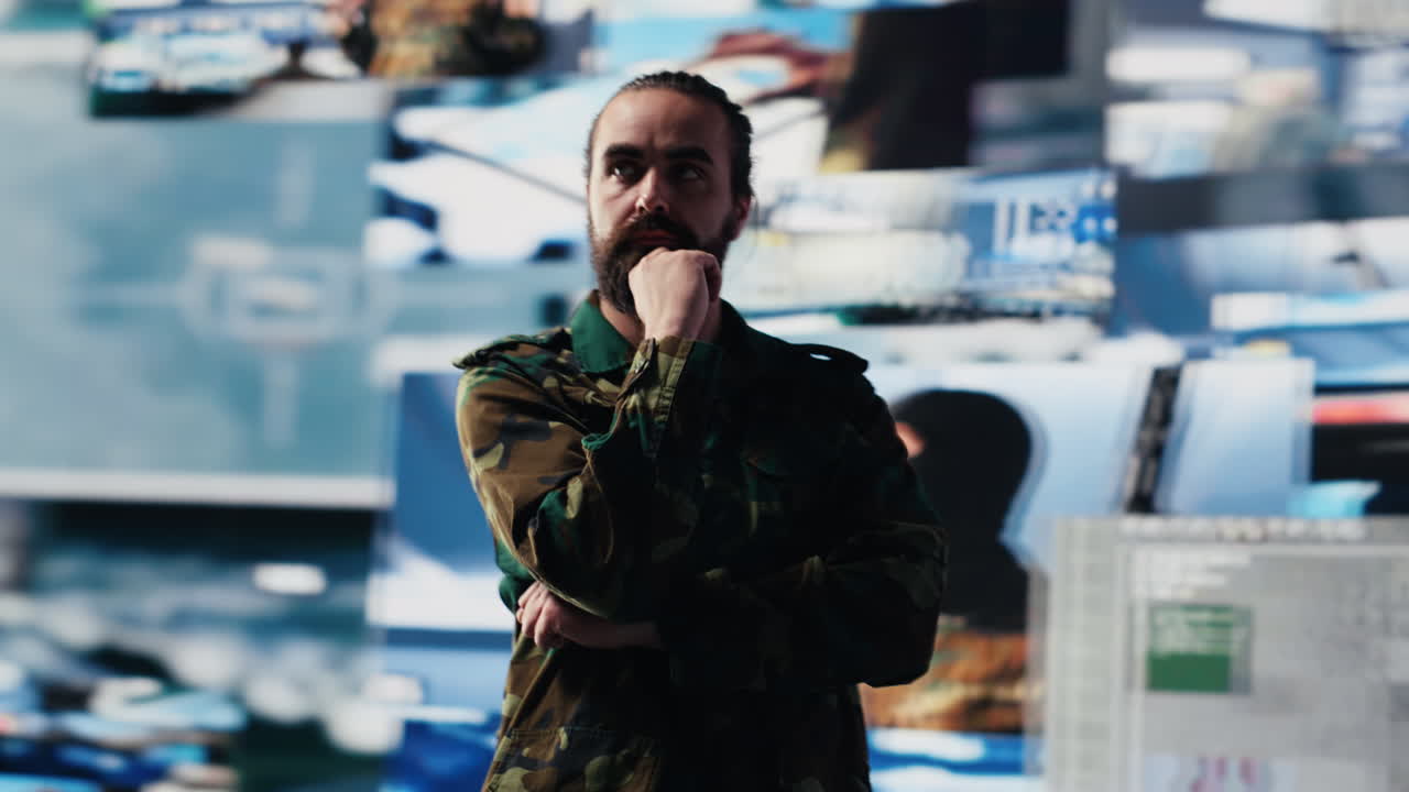 Male army officer operates from a mission command center with digital tech