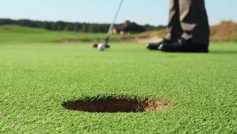 golfer putting on a golf course