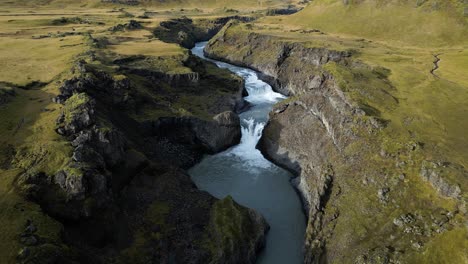 Breathtaking-Waterfall-and-River-in-Southeast-Iceland-near-Ring-Road,-Aerial-Landscape