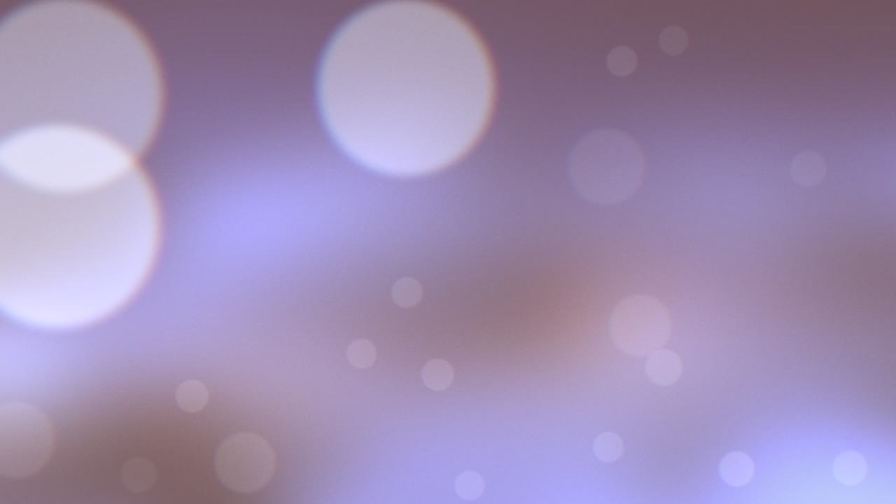 volar blanco redondo bokeh y brillos sobre fondo púrpura