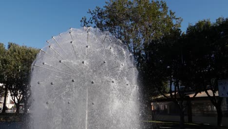 slowly rotating around dandelion shaped water fountain in hlavaty park in koper, slovenia