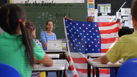 in school, children holding american flag with constitution animation overlay