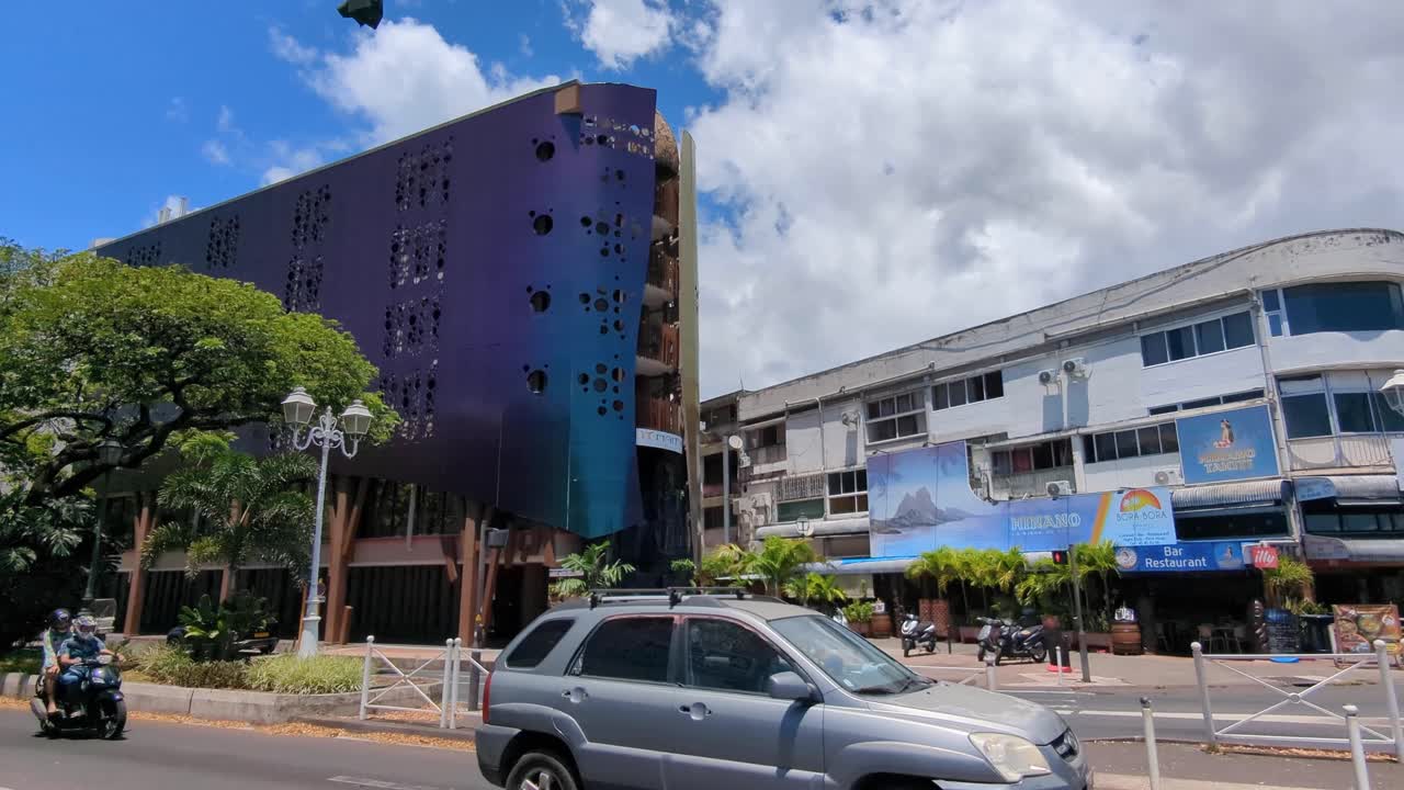 Exterior street view of Maitai Express Tahiti hotel building and inner city traffic in Papeete, Tahiti, French Polynesia