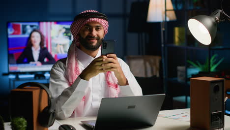 arab man chatting with friends online