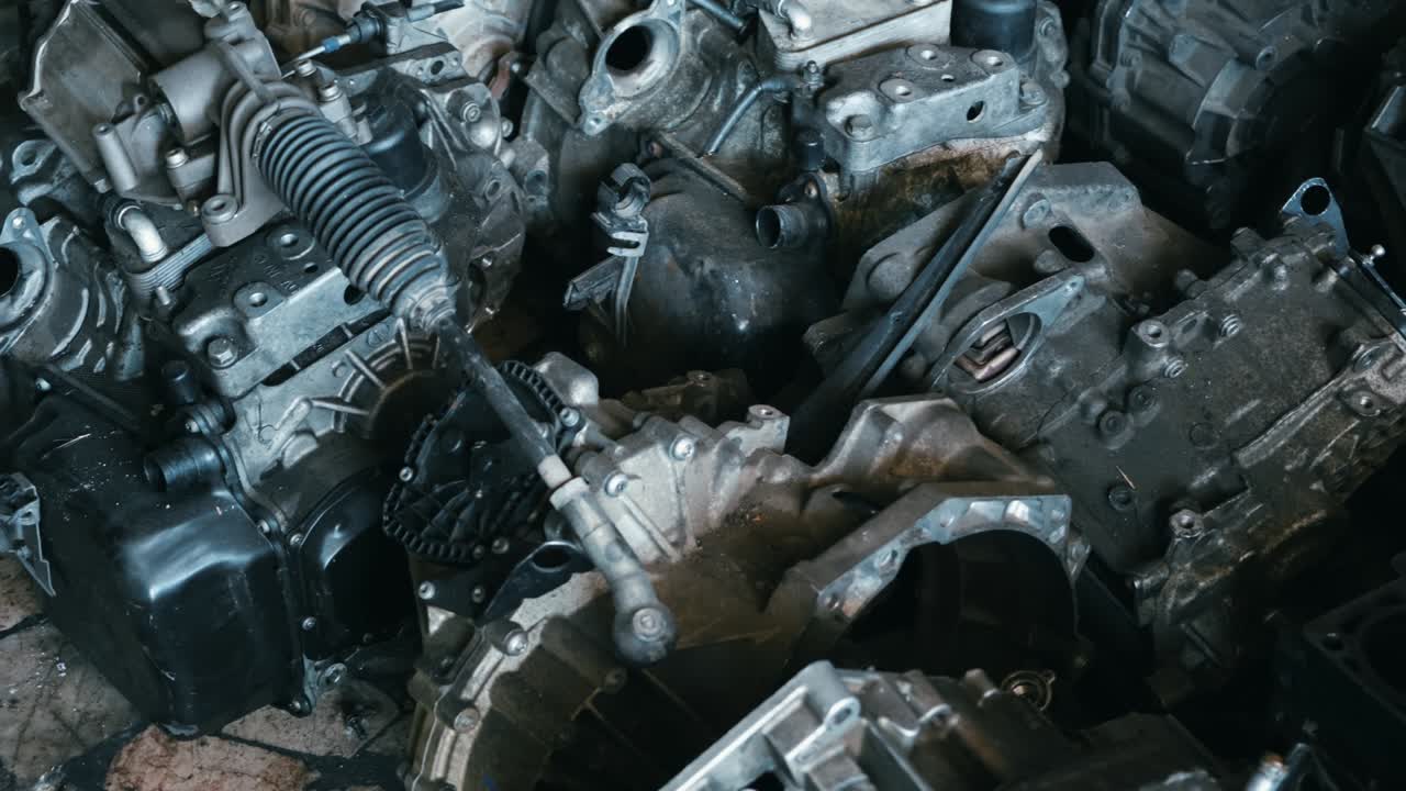 Warehouse of used auto engines of old cars at mechanical parts factory, auto parts and old motors pile, Old car parts