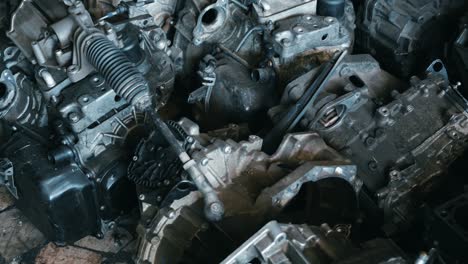 warehouse of used auto engines of old cars at mechanical parts factory, auto parts and old motors pile, old car parts