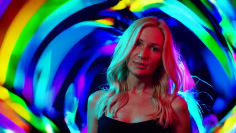 portrait of a blonde woman with a colorful background