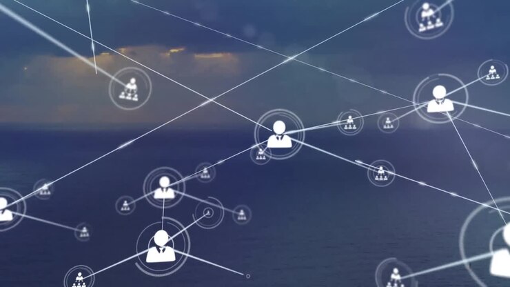 Animation of network of profile icons against aerial view of landscape with ocean and sun in the sky