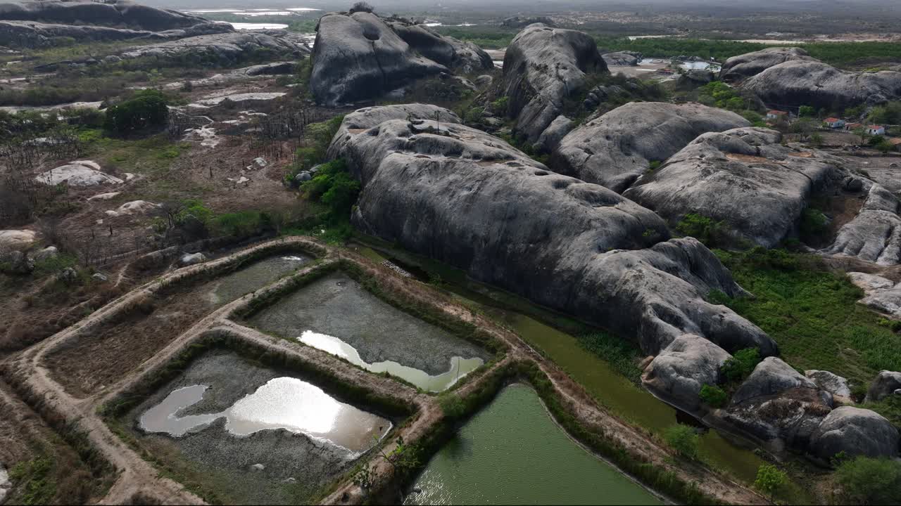 Flooded marshland areas and massive rocky hill in Chaval, Ceara, Brasil. Aerial view