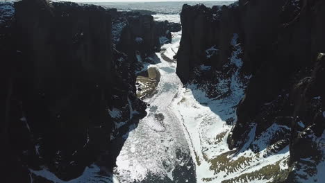 aerial view drone flying in beautiful scenery between mountains in cold iceland