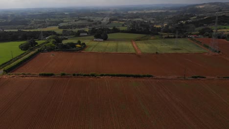 Cinematic-aerial-view-flying-over-recently-harvested-potato-fields-in-New-Zealand