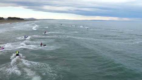 jet ski riders warm up for event at new brighton beach, pegasus bay