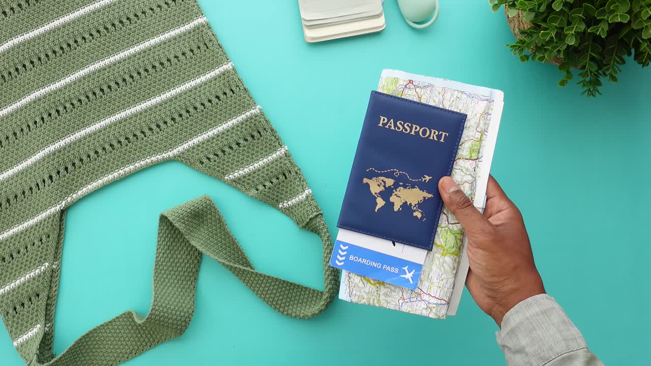 Travel essentials: passport, boarding pass and map