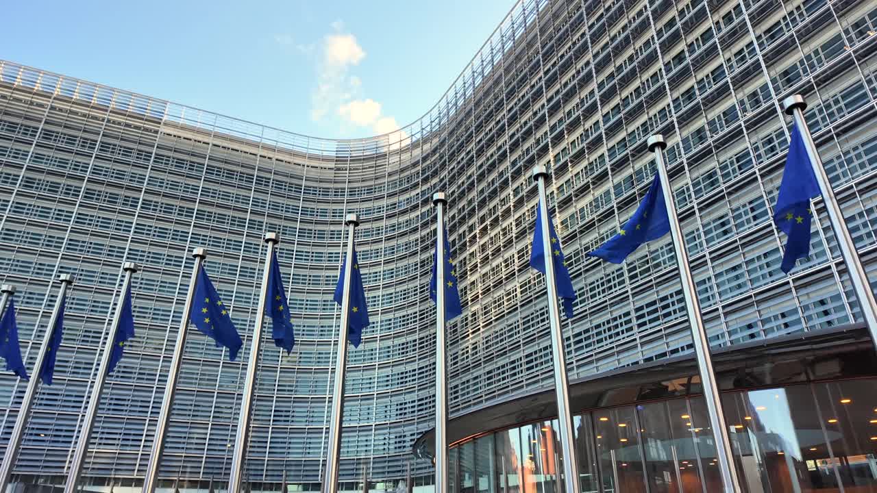 EU flags waving in front of Berlaymont Commission headquarters