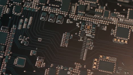 close-up of a dark electronic circuit board with various components