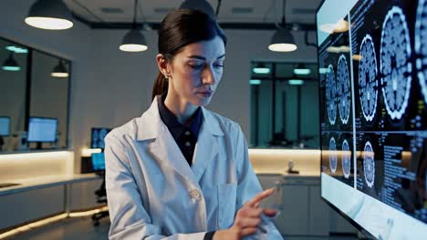 doctor reviewing brain scan images in modern medical facility