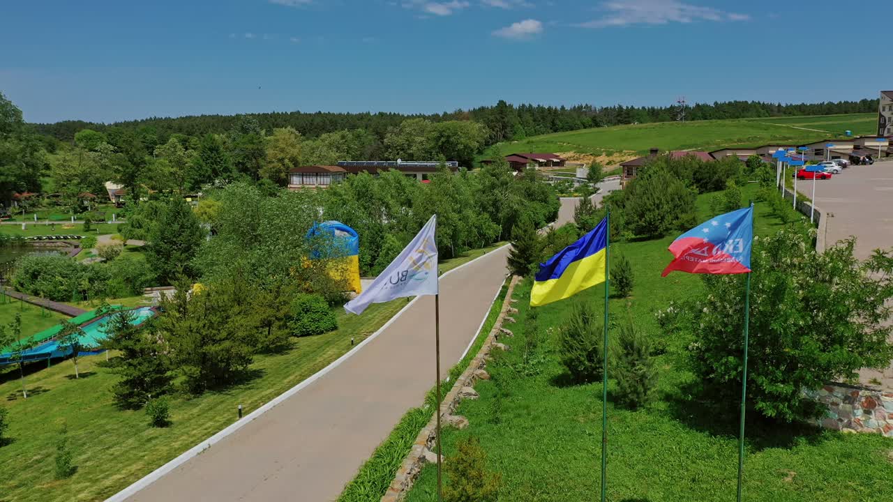 National flag of Ukraine. Aerial view of Ukraine flag waving on the wind against the blue sky