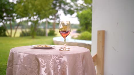 holy communion on a round table with nature in the background