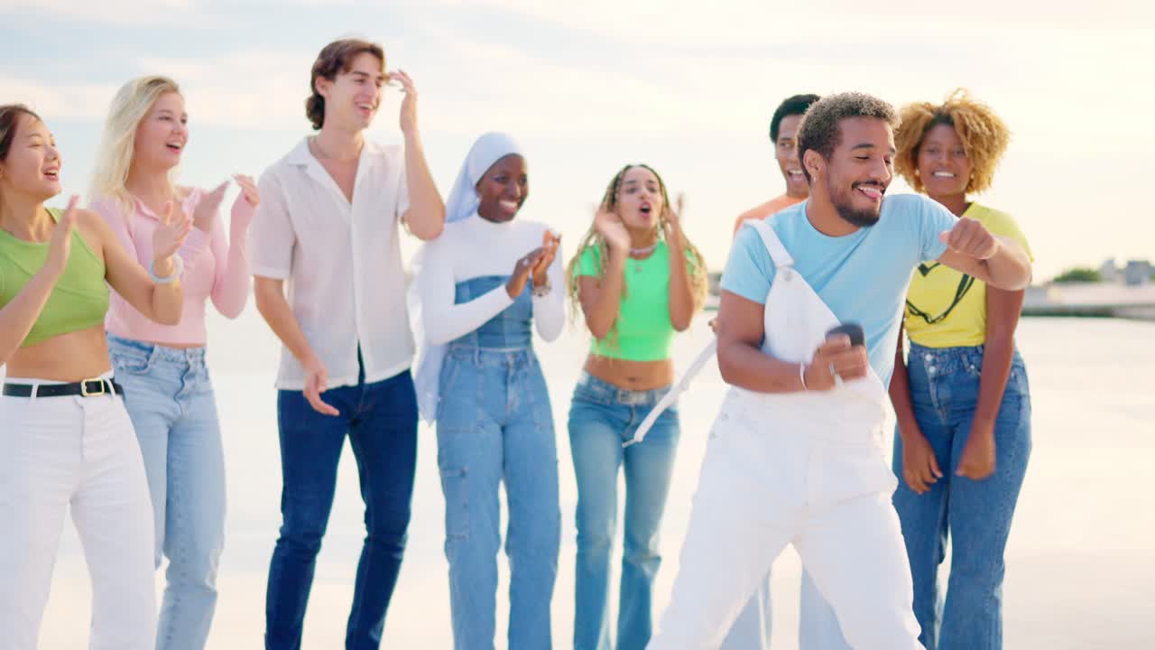 Multi-ethnic friends dancing freestyle and clapping hands