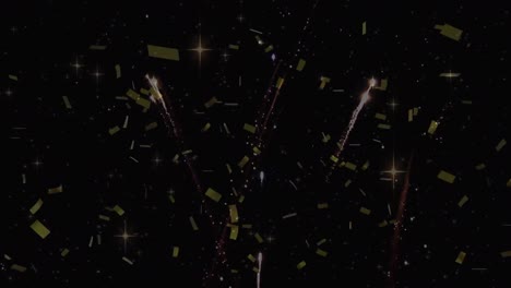 animation of gold confetti falling over fireworks exploding, on black