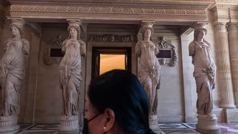 people entering and exploring the louvre museum