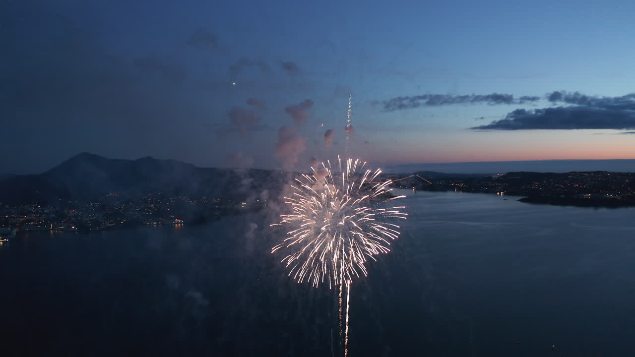 Beautiful aerial shot of fireworks over Bergen, Norway just after sunset