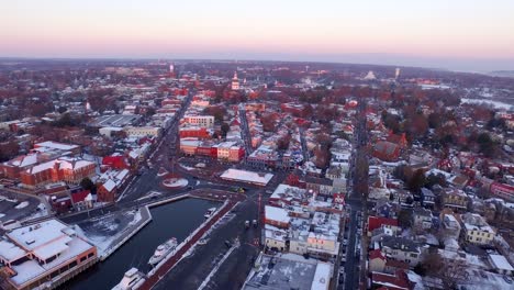 purple dawn over historic downtown annapolis and state capital building, aerial wide shot