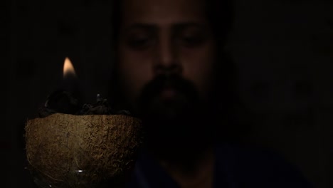 indian monk with mashal(fire stick torch)