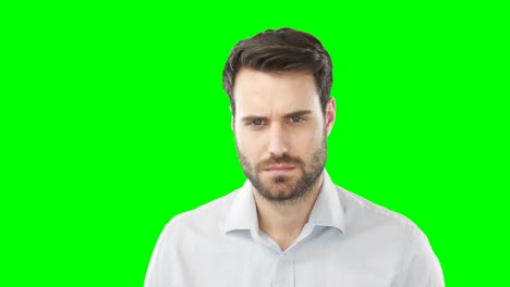 Worried-man-standing-against-green-screen