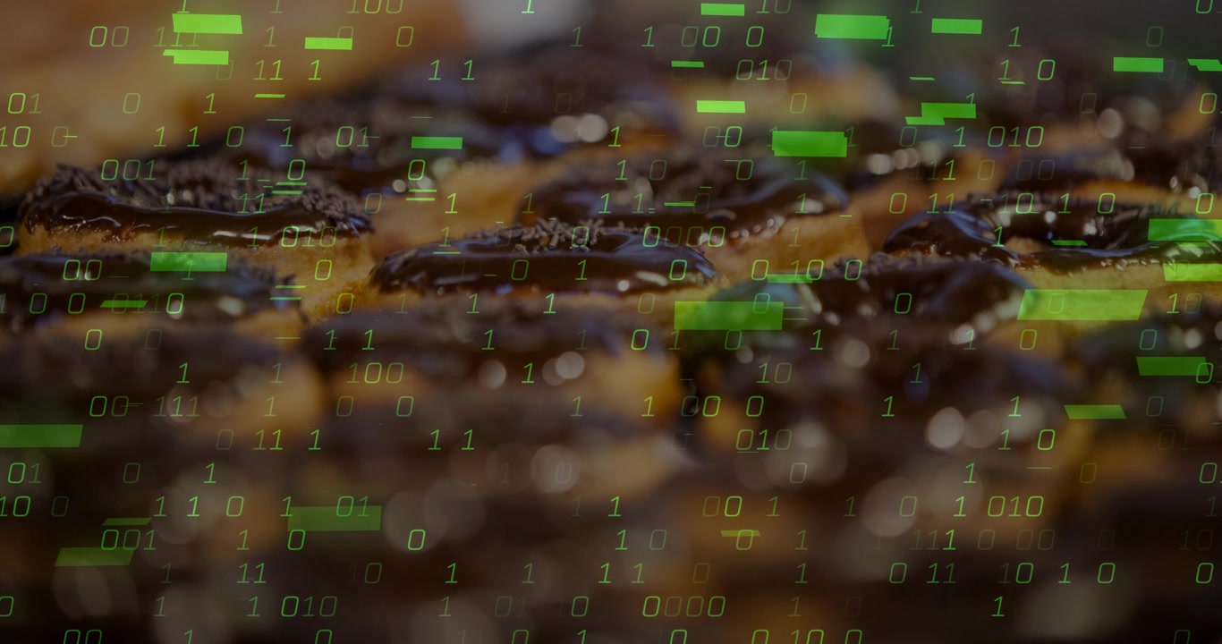 Chocolate pastries staying static while green binary code fading in then rising, showing data