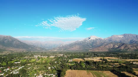 sowing-and-harvesting-of-pirque,-with-the-Andes-mountain-range-in-the-background,-country-of-Chile