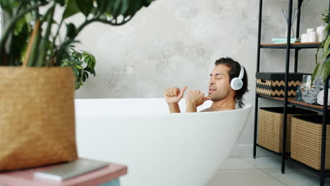 man singing in a bathtub