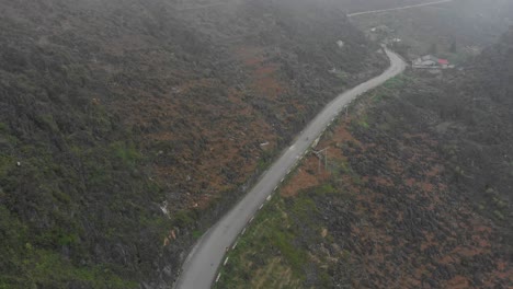 Motorbike-on-famous-Ma-Pi-Leng-Pass-at-Vietnam,-aerial