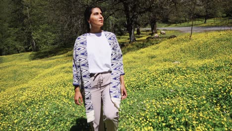 woman in a field of yellow flowers