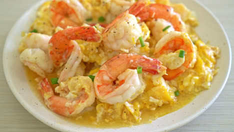 homemade creamy omelet with shrimps or scrambled eggs and shrimps