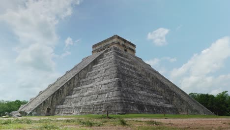 4k cinematic landscape footage of the mayan ruins monument of chichén itzá, one of the seven wonders, in yucatan, mexico on a sunny day