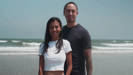 couple holding fins for diving