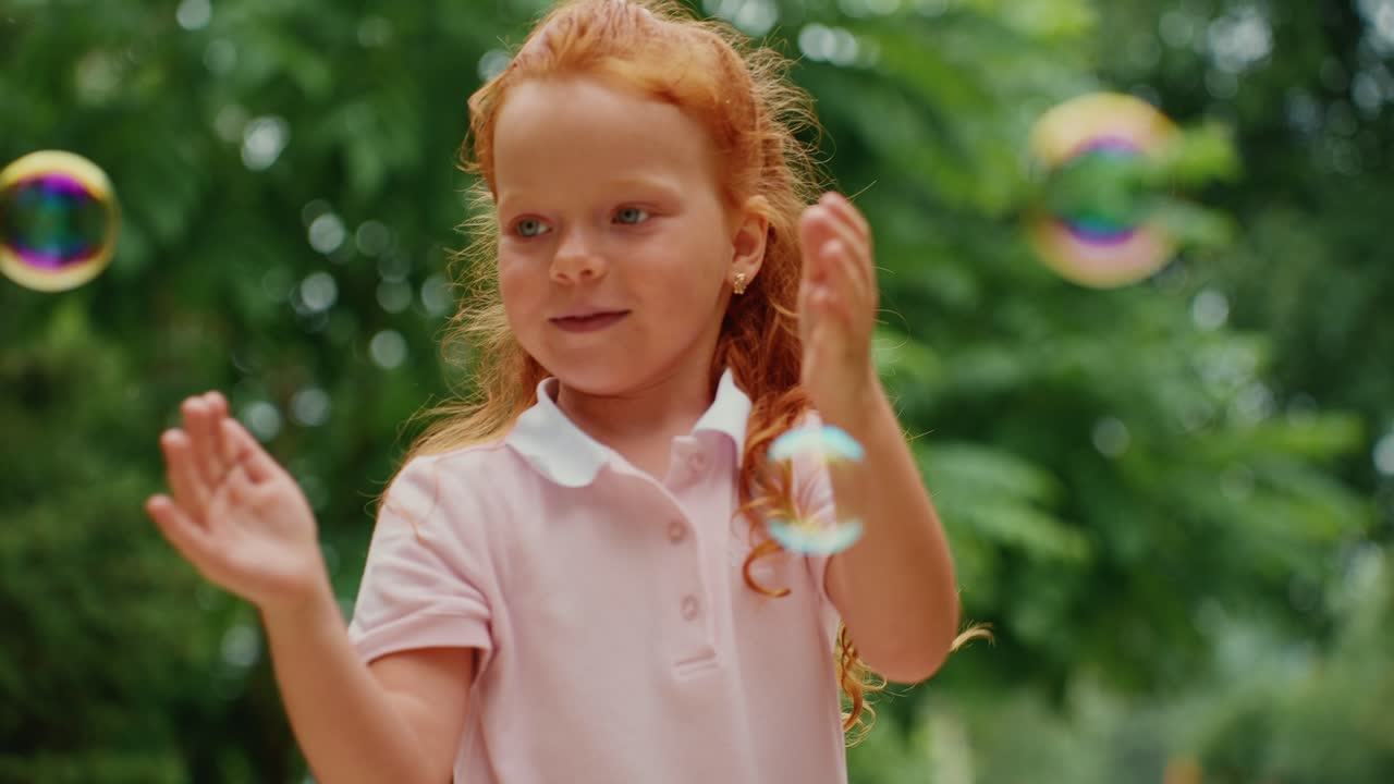 Little Girl Playing with Bubbles