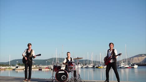 band performing at a waterfront venue