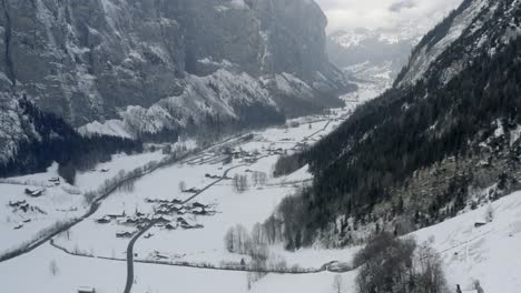 drone aerial of lauterbrunnen surrounded by the mountain eiger in the swiss alps