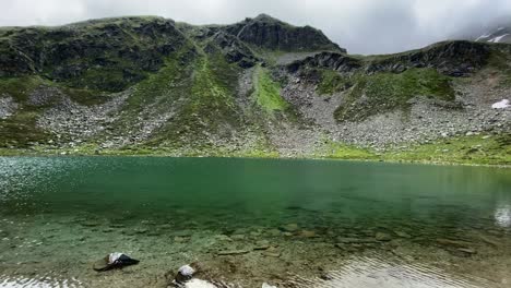 Beautiful-turquoise-Mittlerer-Plenderlessee-with-nice-reflections-and-great-mountains-in-the-background,-very-close-to-Kühtai-in-Tyrol,-Austria