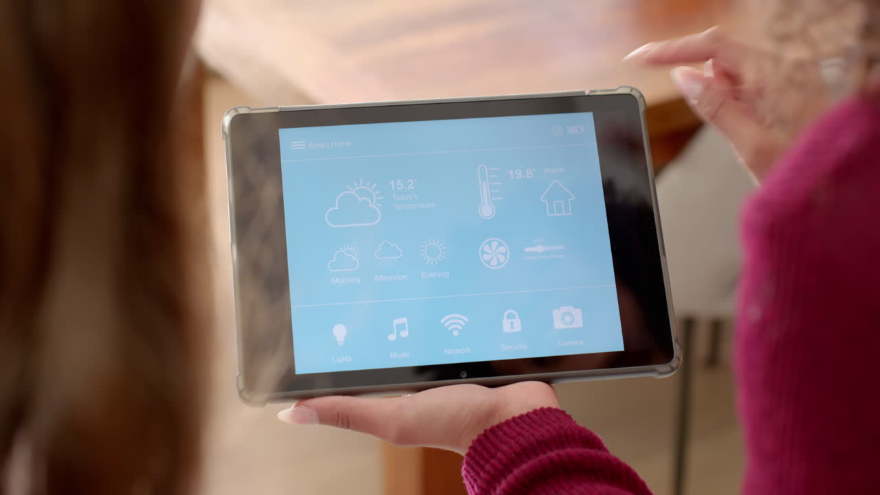 Holding tablet, women managing smart home settings together in living room