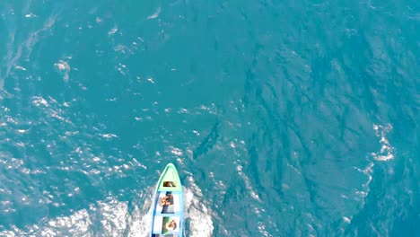 water taxi carries people across turquoise ocean off madagascar