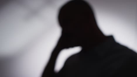 close up silhouette of depressed mature man struggling with mental health in slow motion 3