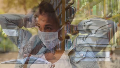 woman in face mask against woman reading book in a library