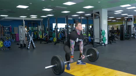 man weightlifting in a gym