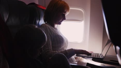 Mom-And-Daughter-In-The-Cabin-My-Mother-Works-With-A-Laptop